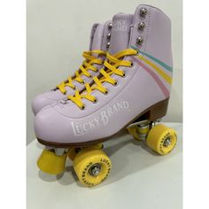 a pair of roller skates with yellow wheels