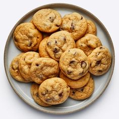 a plate full of chocolate chip cookies on a table