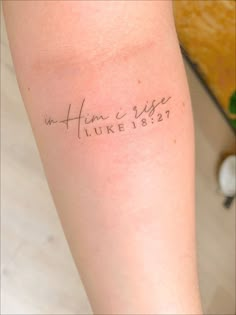 a person with a tattoo on their arm that says, in heaven we are luke