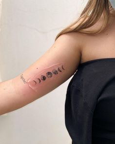 a woman with a tattoo on her arm