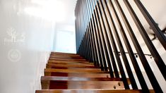 the stairs are made of wood and have metal handrails