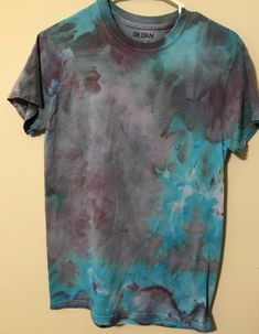 a t - shirt that has been dyed with blue and purple dyes on it