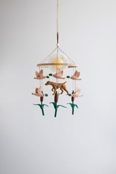 a bird mobile hanging from the ceiling