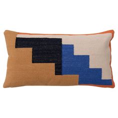 an orange and blue pillow on a white background