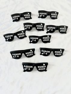 six pairs of personalized sunglasses with names on them