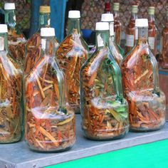 several bottles filled with different types of food