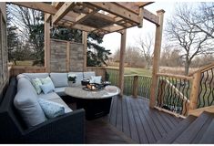 a couch and table on a wooden deck