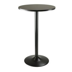 a black round table with a metal base on an isolated white background for use in any room