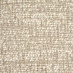 an upholstered fabric textured with brown and white dots on the outside of it