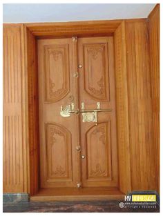 an open wooden door with ornate carvings on it