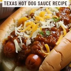 there is a hot dog with chili and cheese on it