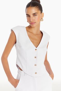 Top Wide Shoulder Gold Dome Buttons Shoulder Pads Unlined 100% Polyester Dry Clean Only CI-32147 White Fitted Structured Top, Chic Structured White Top, Chic White Structured Top, Fitted White Tops With Structured Shoulders, Chic White Tops With Structured Shoulders, White Spring Tops With Structured Shoulders, White Top With Structured Shoulders For Spring, White Tops With Structured Shoulders For Spring, Dress Vest