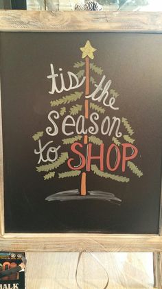 a chalk board with the words tis the season to shop written on it