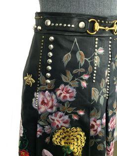 We the ity of this never Gucci Hand-Painted Leather Skirt Size M NEW crafted from supple black pleated leather with hand-painted flowers with hand-embroidered floral designs and studded detail. Featuring a gold-tone horsebit buckle on the waistband, a side zip closure and crepe silk lining.Condition: Pristine. This is a brand new item, never item. Black leather Size 42 (IT) Hand painted/embroidered flowers Stud detail Horsebit accent Side zip closure Fully lined Measurements, Waist 28'', Length 20.5” Luxury Spring Skirt, Bead Embroidery Patterns, Jimmy Choo Sunglasses, Hand Painted Leather, Painting Leather, Hand Painted Flowers, Dior Shoes, Louis Vuitton Shoes, New Crafts