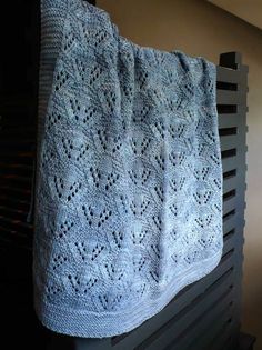 a blue blanket hanging from the side of a radiator