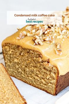 a close up of a loaf of cake with nuts on top