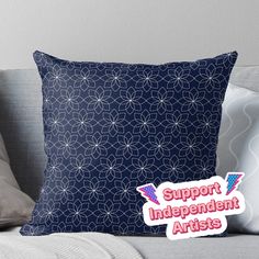 a blue pillow with the words support independent artists on it and an image of a starburst