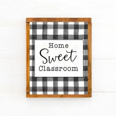 a black and white checkered frame with the words home sweet classroom written in it