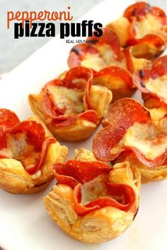 mini pepperoni pizza puffs on a white platter with the words pepperoni pizza puffs