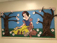 a bulletin board with snow white and the seven dwarfs on it