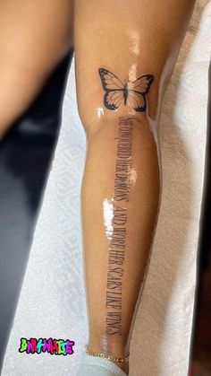 a woman's leg with a butterfly on it and the words i love you