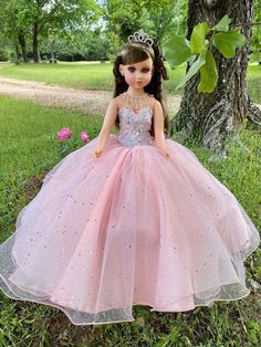 Beautiful dolls for your quinceañera, we make them in any color, they measure approximately 23" Each dress of our dolls is custom designed matching the tone to the color of your quinceañera dress. It is worth mentioning that the tone of the fabric may vary, as well as the accessories (crown, earrings or necklace) If you need a more personalized doll or one that matches your dress, it can also be made, the important thing is to see her happy on her most special day. Our specialty is satisfying our clients. You can contact us if you require a custom design. Contact: 817-443-7252 FB: Norma Vazquez Fashion Designer https://www.facebook.com/profile.php?id=100077462744454 Dark Brown Curly Hair, Purple Quince, Quinceanera Pink, Pink Quince, Special Colors, Brown Curly Hair, Quinceanera Dresses Pink, Crown Earrings, Dress Colors