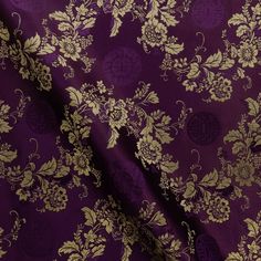 a purple and gold floral print fabric