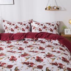 a bed with red and white flowers on it