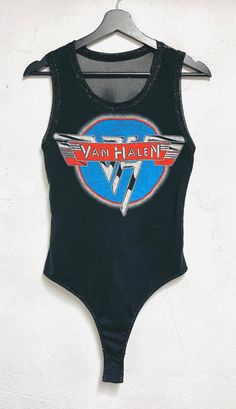 One of a kind handmade Van Halen bodysuit. Silver metallic detailing in the neckline and armholes.  Stretch metallic lightweight mesh fabric  on the back. Snaps on the bottom for easy entry.  Fitted  Size Small Bust 34-36 inch circumference Metallic Stretch Bodysuit For Club, Metallic Stretch Sleeveless Bodysuit, Metallic Sleeveless Stretch Bodysuit, Metallic Fitted Sleeveless Bodysuit, Metallic Sleeveless Fitted Bodysuit, Fitted Bodysuit For Summer Festivals, Stretch Bodysuit For Summer Music Festival, Summer Music Festival Stretch Bodysuit, Tank Bodysuit For Party