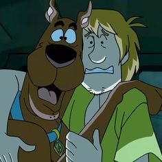 scooby and shaggy looking man hugging each other