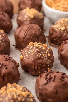 chocolate truffles with nuts and sprinkles on top