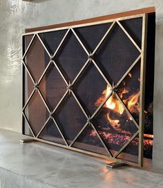 a fireplace screen that is on top of a table