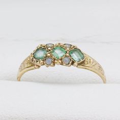 George V 15ct yellow gold Ring set with emerald and split pearls, Marked Birmingham 1921 JP Size Q - Can be resized Victorian Emerald Ring In Yellow Gold Stamped 14k, Antique Emerald Ring In Stamped 14k Yellow Gold, Victorian Emerald Ring In 14k Yellow Gold, Victorian Green Jewelry Stamped 14k, Green Emerald Ring With Rose Cut Diamonds For Anniversary, Anniversary Green Emerald Ring With Rose Cut Diamonds, Victorian Emerald Ring In Yellow Gold, Victorian Yellow Gold Emerald Ring For Anniversary, Vintage Gold Emerald Ring With Rose Cut Diamonds