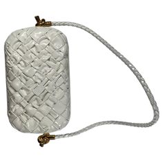 Bottega Veneta Knot Minaudiere on Strap in Bone Gorgeous Condition! Gorgeous Bottega Veneta Knot Miniaudiere Bottega Veneta shoulder bag in intrecciato calf leather Rolled shoulder strap with metal knot hardware Appx 4.7" H x 7.9" W x 2.2" D Retails for $4500 A Great Deal! Purse is in excellent condition. Maybe one or two very minor scuffs on exterior leather (bottom). Barely any signs of use. See photos for details. Leather Roll, Vanity Case, Bottega Veneta Shoulder Bag, 7 H, Bottega Veneta, Calf Leather, Bones, Shoulder Strap, Chanel