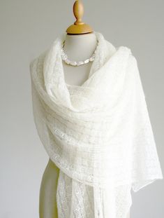 Fragrant stole for the bride in cream-ivory white - a delicate shawl for the summer wedding. The knitted shawl is handmade from the finest Italian yarns. A knitted viscose thread gives the scarf an elegant but subtle shine. The accessory is extra long and patterned; it has beautiful arched borders on both end edges. Due to its length, the knitted scarf can be wonderfully draped. The color is a light creamy white/champagne color/pastel vanilla Size: Length approx. 210 cm (approx. 84 inches) Width Shoulder Shawl, Wedding Scarf, Mohair Scarf, Festive Wedding, Knitted Shawl, Hue Color, Wedding Cape, Cream Wedding, Cream Tones