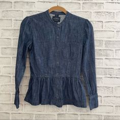 Lucky Brand Dark Wash Chambray Shirt True Indigo Collection Size 2 Snap Front And Cuffs Peplum Styling Lightweight Euc If Not Nwot. I See No Signs Of Wear On This Item, And It Feels New To Me. Measured Flat: Pit To Pit: 16" Sleeve: 21" From Back Collar Down To Bottom: 22.5" Great Top By Lucky Brand! Perfect To Dress Up Or Down And Just So Many Ways To Style This Top! Remember To Visit My Closet, Do Some Shopping And Bundle! If You Create A Bundle, I Will Send You An Offer With My Best Possible B Light Wash Fitted Denim Top For Work, Spring Denim Blue Blouse With Pockets, Fitted Light Wash Denim Top For Work, Fitted Denim Blue Cotton Blouse, Dark Wash Summer Top For Work, Fitted Collared Denim Top, Casual Fitted Collared Denim Top, Fitted Collared Denim Top Casual Style, Fitted Cotton Blouse With Pockets