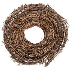 a round wreath made out of twigs on a white background