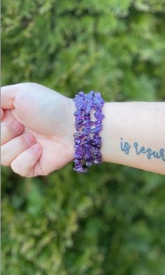 "The Healing Stone: Amethyst symbolizes a balanced, calm, intuitive mind. Stretchy Amethyst chip bracelet offered in 6.5\", 7\", 7.5\", and 7.75\". Amethyst is water-safe, but should not be submerged for a prolonged period of time. Every order comes with a free scoop of the month's crystal confetti mix and, if you purchase five or more bracelets, a free intuitively chosen bracelet." Purple Beaded Bracelets With Natural Stones For Healing, Spiritual Healing Wrap Bracelet With Round Beads, Amethyst Beaded Bracelets For Healing With Natural Stones, Healing Crystal Bracelet With Gemstone Beads, Healing Gemstone Beads Crystal Bracelet, Purple Bracelets With Gemstone Beads, Spiritual Wrap Bracelet With Round Beads For Meditation, Purple Beaded Stretch Bracelet For Healing, Lavender Beaded Bracelets For Healing