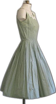 1950s Style Gingham Dress For Picnic, Vintage Sleeveless Spring Plaid Dress, Vintage Sleeveless Plaid Summer Dress, Vintage Sleeveless Plaid Dress, Vintage Plaid Sleeveless Dress, Vintage Sleeveless Plaid Cotton Dress, Vintage Gingham Plaid Knee-length Dress, Fitted Sleeveless Retro Plaid Dress, Fitted Sleeveless Plaid Vintage Dress