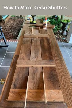 a wooden table with the words how to make cedar shutters on it and an image of