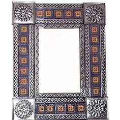 a decorative mirror with an ornate design on it