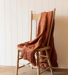 a chair with a blanket on top of it