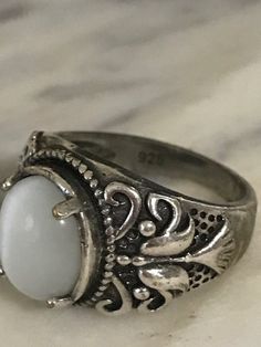 Beautiful Sterling Silver Ring, Vintage Filigree Ring, 925 Silver Chunky ring, Size 9 1/4, Estate Jewelry, Ring for Her What a lovely ring! This ring has white stone that changes shade shade gray depending on the light. I love the designs that it has on the sides. This ring has very good weight and any woman would fall in love with this ring. Perfect to give on any occasion! In great condition! Stone size 17 mm X 14 mm If you purchase more than one item in our shop, we are happy to combine them Chunky Gothic Rings, 70s Silver Jewelry, Chunky Y2k Rings, Chunky Ring With Stone, Cool Chunky Rings, Antique Jewelry Silver, Funky Silver Rings, Silver Chunky Ring, Vintage Filigree Ring