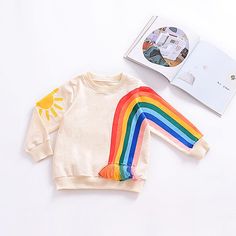 Children's Tassel Rainbow Sun Printed Long Sleeve Sweater T-shirt - PrettyKid Fun Long Sleeve T-shirt For Playtime, Multicolor Long Sleeve Top With Cartoon Print, Long Sleeve Cotton T-shirt For Playwear, Multicolor Long Sleeve Cotton Sweatshirt, Spring Cartoon Print Sweatshirt, Spring Cartoon Print Long Sleeve Sweatshirt, Yellow Long Sleeve Sweater, Long Sleeve Cartoon Print Sweater For Spring, Cute Yellow Long Sleeve Sweatshirt