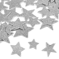 silver glitter stars on white background