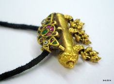 "vintage antique tribal old 22k gold amulet pendant necklace taviz from rajasthan india. nice design made of 22k yellow gold, good for jewelry collection. Note - pendant is filled with wax. Piece is much check pictures carefully for more detail. Height with bells - 3 cm(1.18\") width max.- 3.8 cm(1.5\") weight - 14.5 grams material - 22k yellow gold & original old worn piece." 22k Gold Temple Necklace Pendant For Festivals, Traditional Yellow Gold Temple Necklace With Pendant, Festive 22k Gold Temple Necklace With Pendant, 22k Gold Pendant Temple Necklace For Festivals, Diwali Pendant Temple Necklace With Latkans, Diwali Temple Necklace With Pendant And Latkans, Gold Kundan Pendant Temple Necklace, Temple Jewelry Style Filigree Pendant Necklace, Temple Jewelry Style Necklace With Filigree Pendant