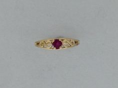 SOLID 14KT YELLOW GOLD BABY RING NATURAL RUBY IS 2 mm ROUND RING SIZE IS 1 WITH GIFT BOX Classic Gold Ruby Promise Ring, Formal Gold Stackable Ruby Rings, Gold Ruby Birthstone Ring With Round Band, Gold Ruby Ring With Diamond Cut, Yellow Gold Diamond Cut Ruby Promise Ring, Classic Yellow Gold Heart Ring With Birthstone, Gold Solitaire Ruby Promise Ring, Gold Ruby Ring Stamped 14k, Gold Ruby Ring For Promise, Stamped 14k