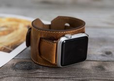 "Premium Leather Apple Watch Cuff Band 38mm-40mm-41mm-42mm-44mm-45mm. Perfectly fits all Apple Watch Series 7 6 5 4 3 2 1 SE (Apple Watch & Sport & Edition Version) Easy Installation- Quick and easy installation. Slid in - Slid out installation. No additional tool is required [Band Size] This watch band is medium size and fits between 150mm(5.9 inch) and 200mm (7.9 inch) wrists. Long Track: Wide: 0.86\" (2.2 cm), Length: 4.68\" (11.9 cm) Short Track: Wide: 0.86\" (2.2 cm), Length: 2.71\" Vintage Cuff Watch Band As Gift, Cuff Bracelet Strap Watch Band Gift, Cuff Watch Band With Bracelet Strap As Gift, Gift Cuff Watch Band With Bracelet Strap, Apple Watch Cuff, Leather Watch Cuff, New Apple Watch Bands, Brown Apple, Personalized Leather Gifts