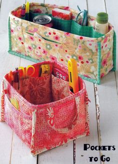 two storage bags sitting on top of a white wooden floor with the words pockets to go written above them