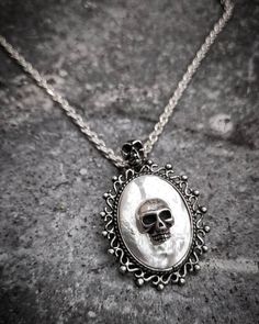 "Victorian Skull White Opal Steampunk Gothic Oxidized Sterling Silver 925 Pendant Necklace on Chain Our beautiful Gothic White Opal Skull Necklace is the perfect finishing touch to your gothic wedding gown. White Opal Skull Gothic pendant will be a hit with your horror-loving friends or anyone who loved a more dark style of jewelry. This is an excellent unique gift for anyone who enjoys Skulls, Halloween, Rockabilly style, Gothic Style, or unique horror artwork. This necklace can be worn with an Silver Punk Jewelry For Halloween, Gothic Sterling Silver Chain Jewelry, Gothic Silver Round Necklace, Silver Gothic Round Necklace, Silver Punk Jewelry With Oxidized Finish, Collectible Silver Skull Jewelry, Punk Style Silver Jewelry With Oxidized Finish, Gothic Sterling Silver Necklaces, Gothic Sterling Silver Chain Necklace